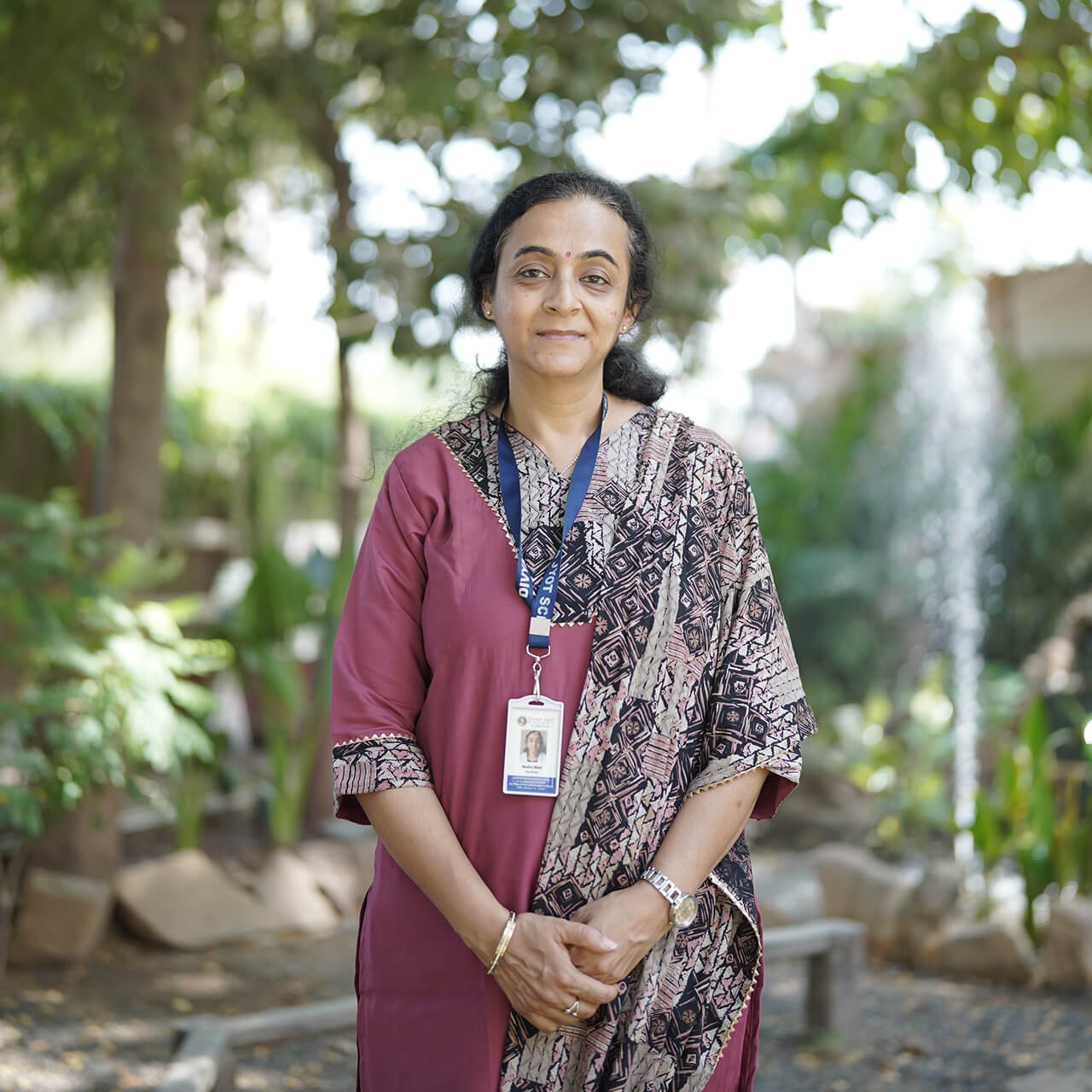 School Teacher Portrait Standing Outdoors in Campus Garden Area