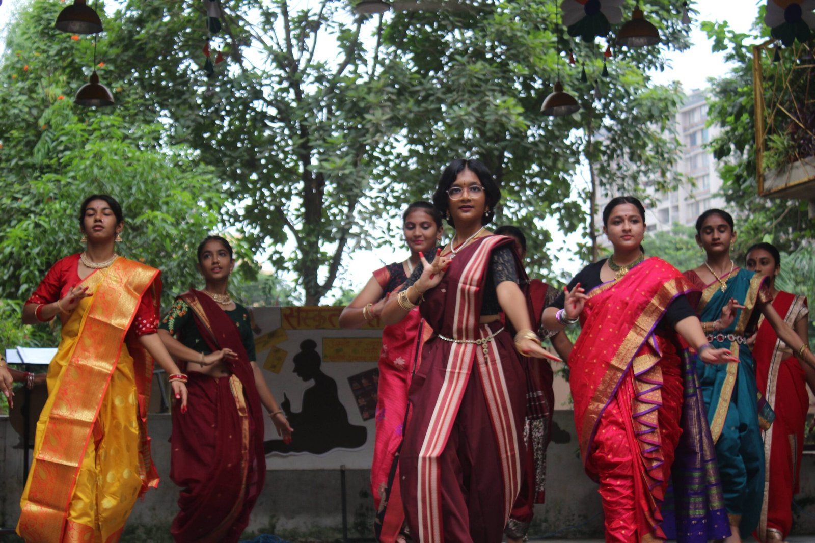 Students Performing Classical Indian Dance in Traditional Sarees